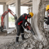 Demolition services Dubai with FastCore workers removing a reinforced concrete wall